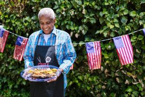 Man carries July 4 BBQ.