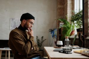 man looking at laptop